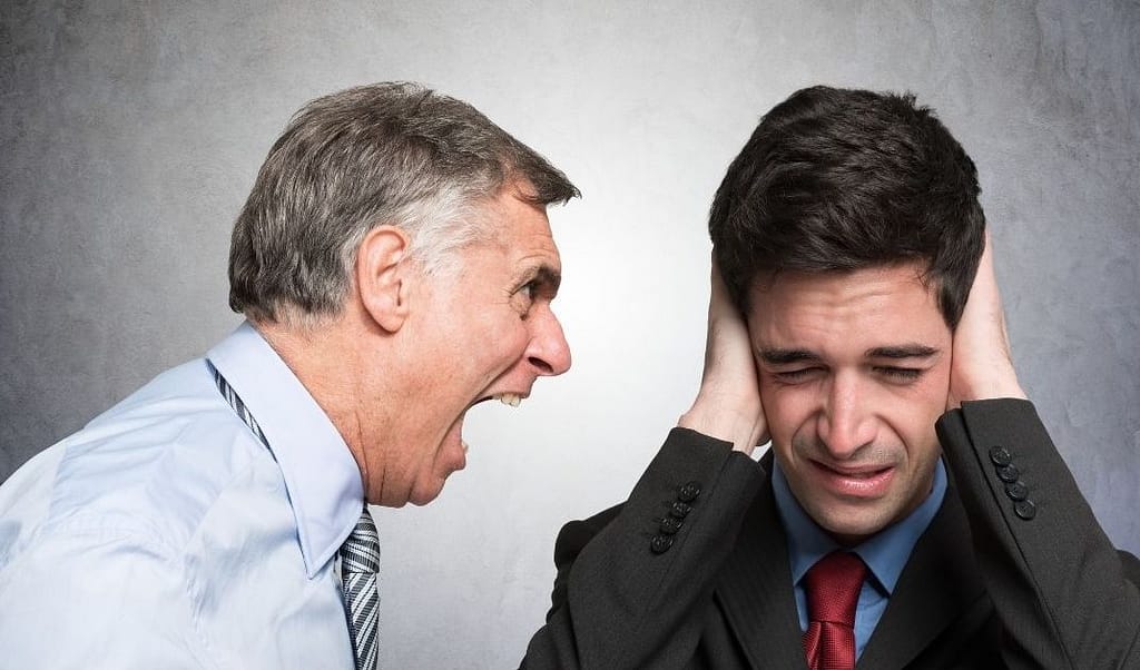 This image shows an individual screaming at another individual who is covering his ears trying to avoid the confrontation. This image is used in the BPS Security article titled, “How to Handle Unruly Guests”.