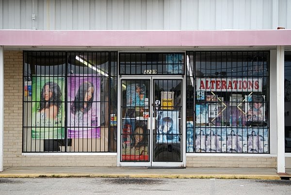 This is an image of a storefront with barred windows and doors. This image is used in the BPS Security article titled, “How Obstructed Windows Can Hurt Business”.