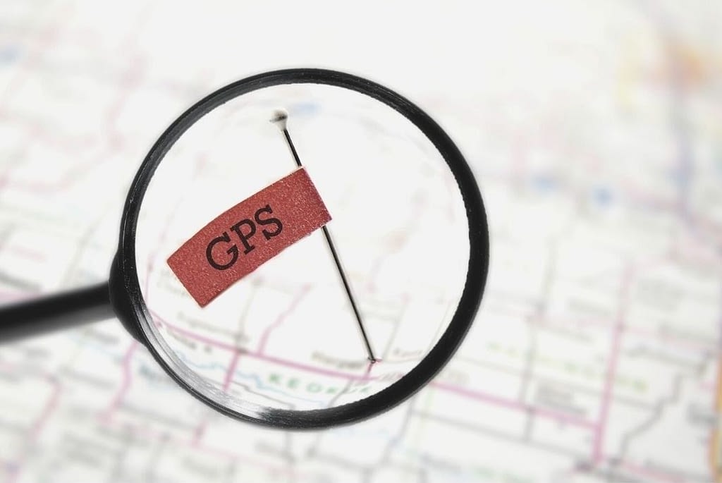 This is an out of focus map with a pin-flag. The pin has “GPS” written on it. The pin is focused on via a magnifying glass. This image is used in the BPS Security Blog title, “Why Every Security Company Should Use GPS”.