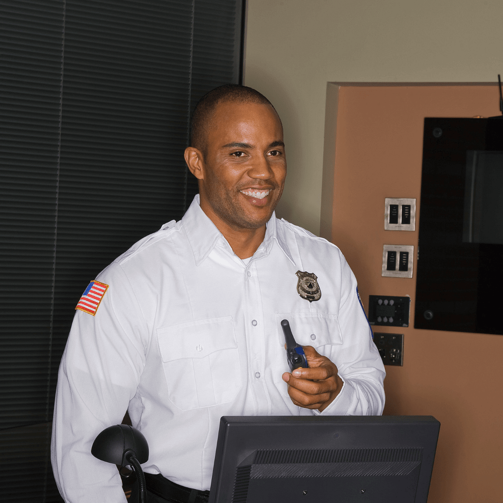 Security Guard in Crisp, Clean Security Uniform, Holding Walkie Talkie, and Smiling