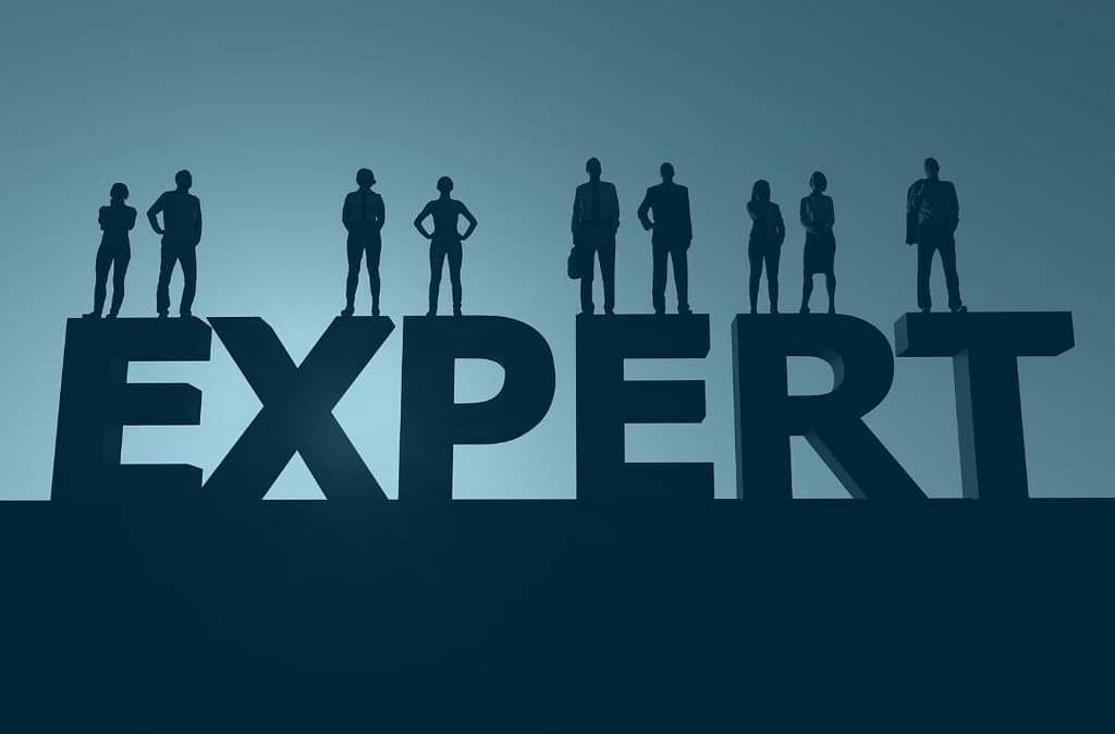 This is an image of eight silhouettes standing on a sculpture of the word “expert”. This image is used in the BPS Security article titled, “5 Types of Security Guard Negligence You Should Not Ignore”.