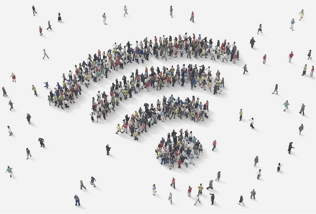 This is a top-down view of many different people standing in what looks like the “wifi” symbol pattern. This image is used in the BPS Security Article titled, “How to Make a Smart Home Security System SAFE.”