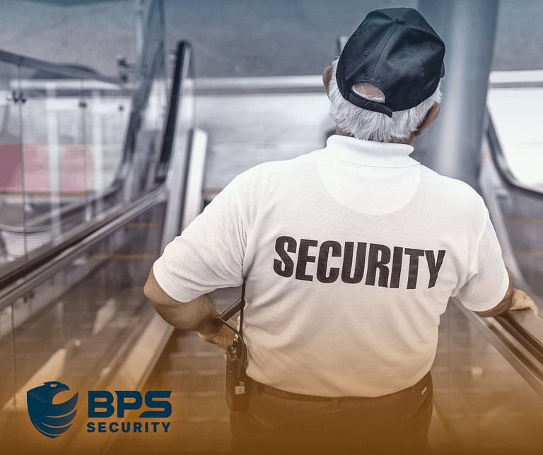 This image shows a security guard descending an escalator. This is the supporter image used in the BPS Security blog titled, “The Importance of Private Security in Today's World: Who Needs It?”