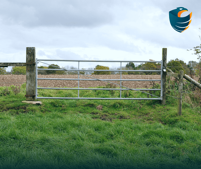 This image shows a farm gate. This is the supporter image used in the BPS Security blog titled, “Comprehensive Guide to Enhancing Farm Security: Tips for Private Security Measures''